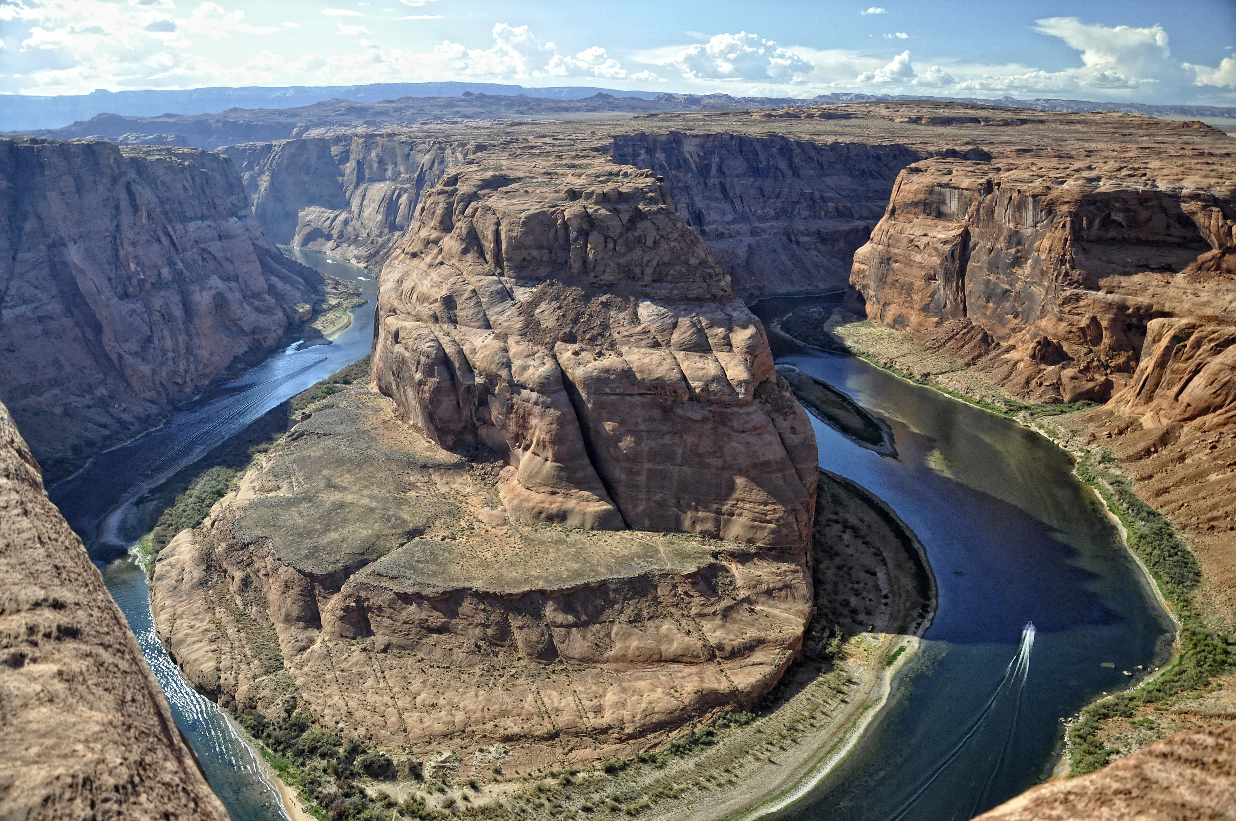 Inside bend of a meandering stream where gold settles